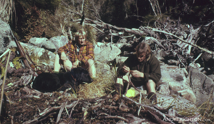 Taking a well needed rest from hunting up a badly log jammed creekbed  and trying to think of a plan B, even the dog has had enough. Side Creek off Hohonu River, Hohonu Ranges, Westland, New Zealand. Andy Leighton, Garry Turnbull, Blue